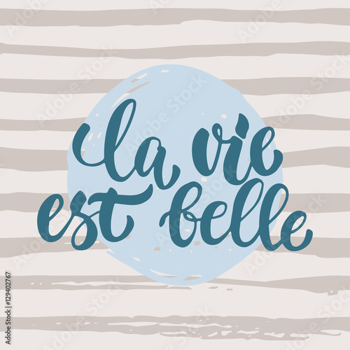 la vie est belle - hand drawn French lettering phrase it means Life is beautiful isolated on striped grunge background. Fun brush ink inscription for greeting card or t-shirt print, poster design