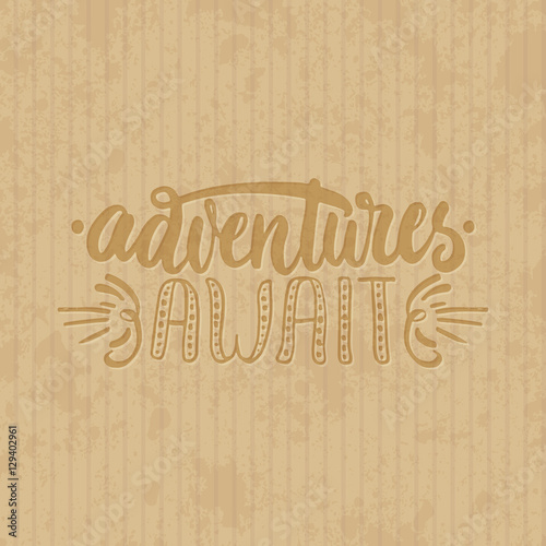 Adventures await - hand drawn lettering phrase isolated on the cardboard grunge background. Fun brush ink inscription for photo overlays, greeting card or t-shirt print, poster design