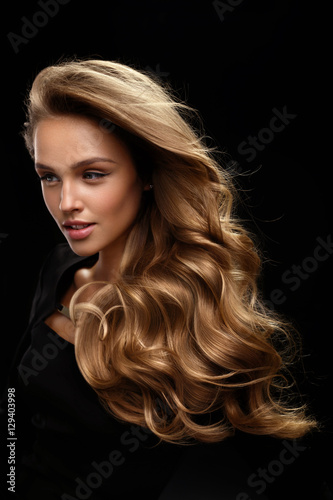 Beautiful Long Hair. Woman Model With Blonde Curly Hair