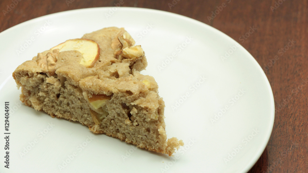Homemade Apple Cake with Walnuts on Wooden Background