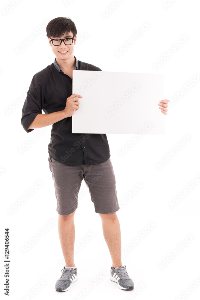 Male student holding a white board against white background. Asi Male student holding a white board against white background. Asi