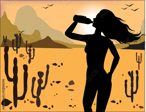 Silhouette of the girl drinking water on the background of the d
