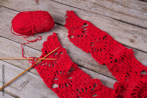 Beautiful knitting with red thread.