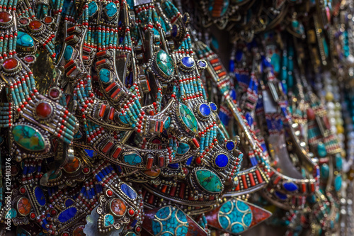 Many necklaces with coral and turquoise on the market stall