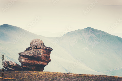 Minimalistic Landscape of rock stone and mountains on background Travel serene scenic view