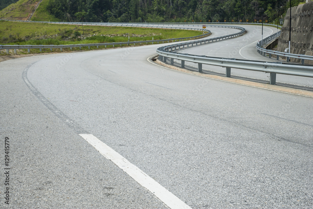 Obraz premium Close up asphalt curve road texture with white stripe