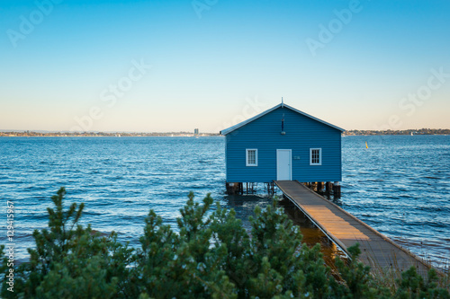 Fotografering Sunset over the Matilda Bay boathouse in the Swan River in Perth, Western Australia