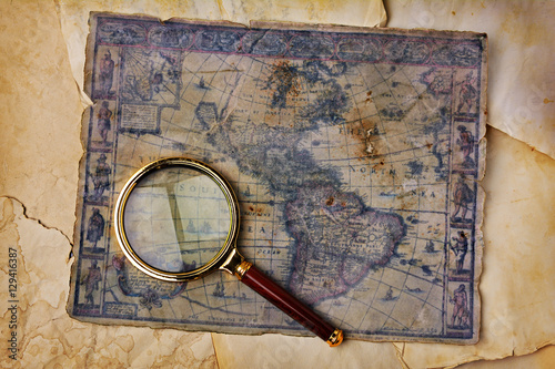Quadro su tela Ancient map and magnifying glass
