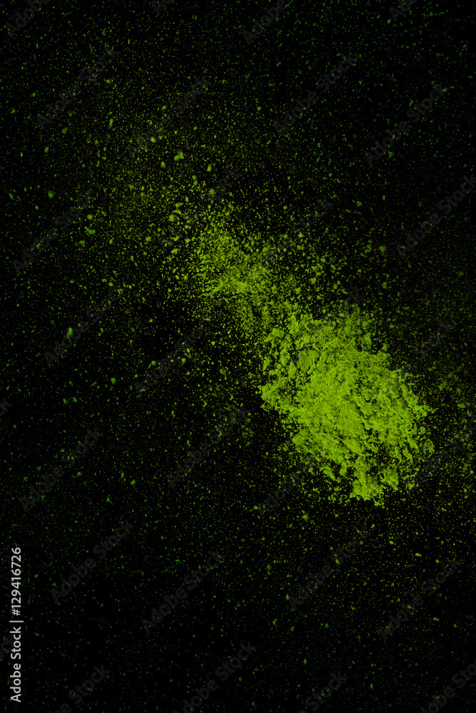 Green colorful powder splash isolated on black background.jpg