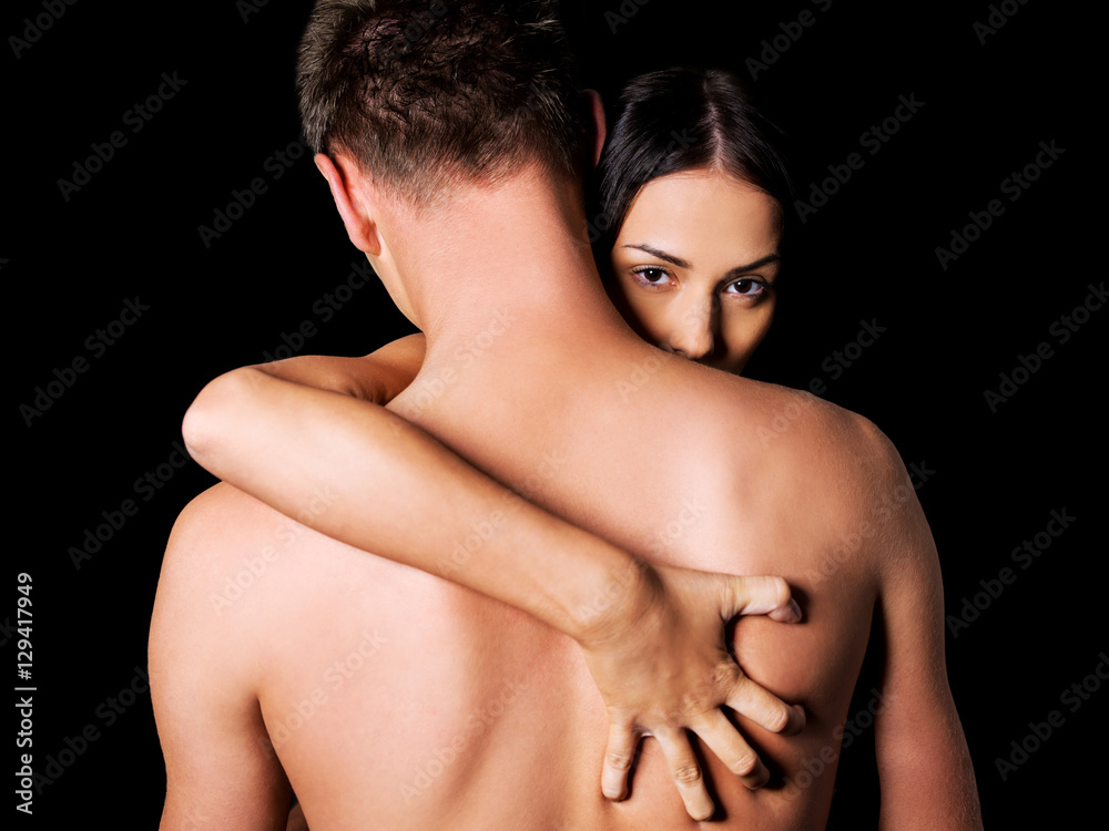 Beautiful nude couple in a tender embrace.