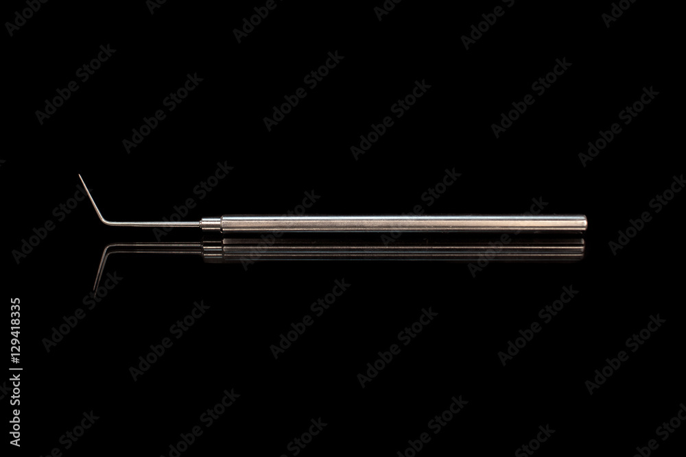 Dentist probe dental equipment in black background Dentist probe dental equipment in black background