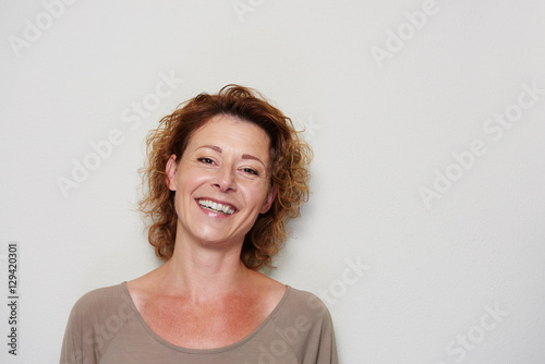 Smiling brunette woman on white background