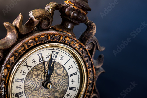 old clock isolated  on black