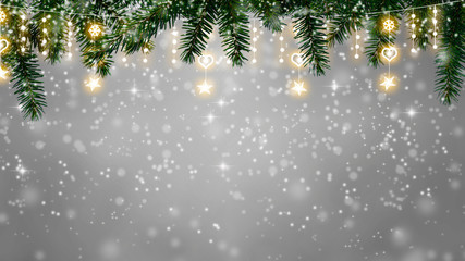 christmas background - twinkling snowfall on fir tee branches with fairy lights, copy space on blurred background