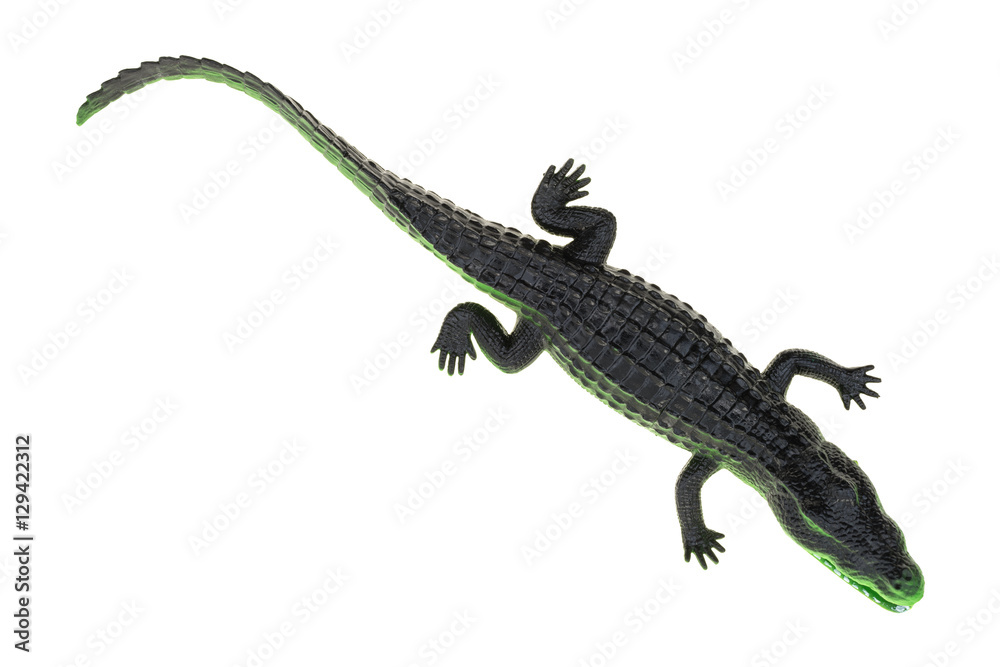 Naklejka premium Toy alligator on a white background top view.