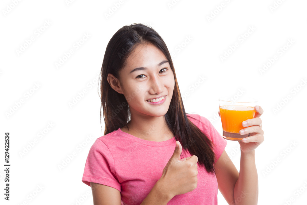 Young Asian woman thumbs up drink orange juice. Young Asian woman thumbs up drink orange juice.