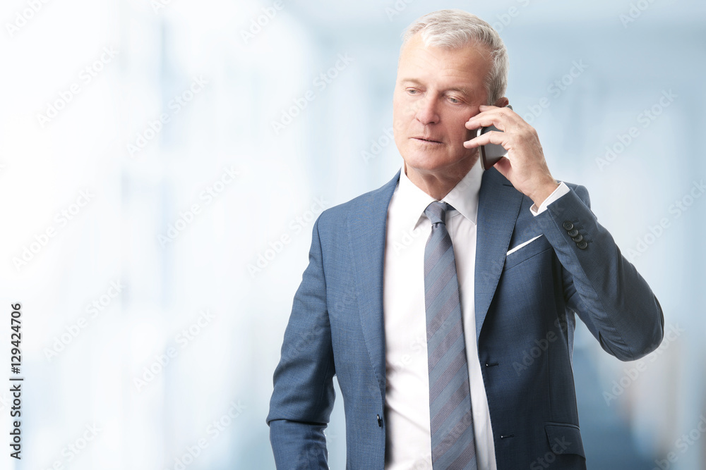 Senior professional man working in the office Senior professional man working in the office