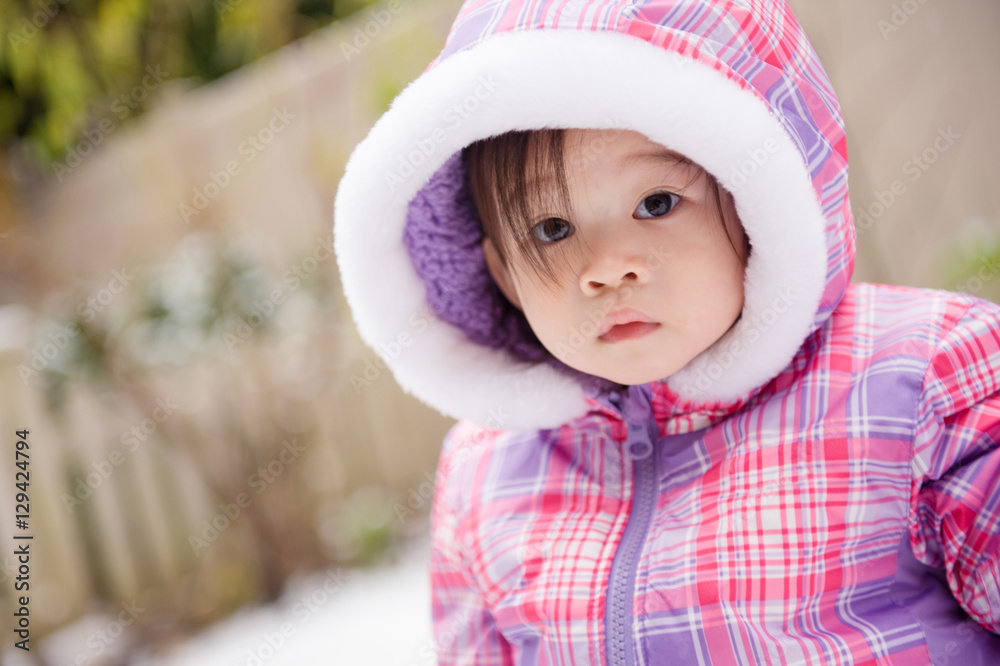 Little girl in winter outerwear Little girl in winter outerwear
