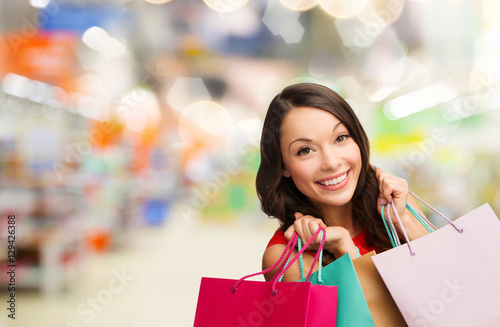 woman with shopping bags at store