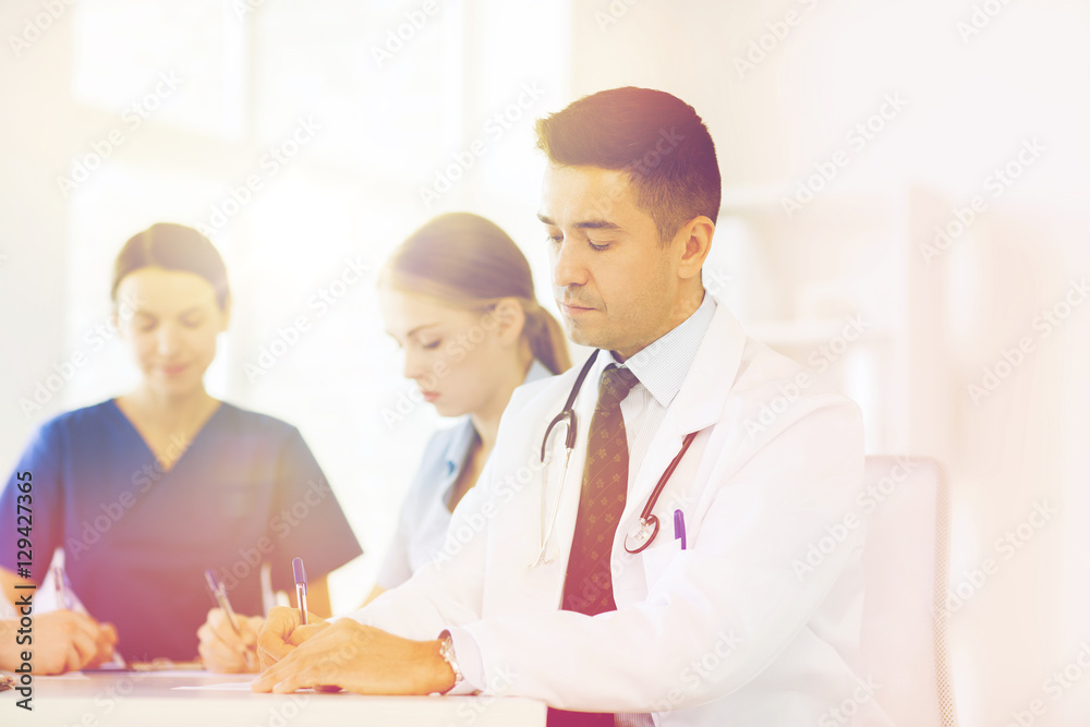 group of happy doctors meeting at hospital office group of happy doctors meeting at hospital office