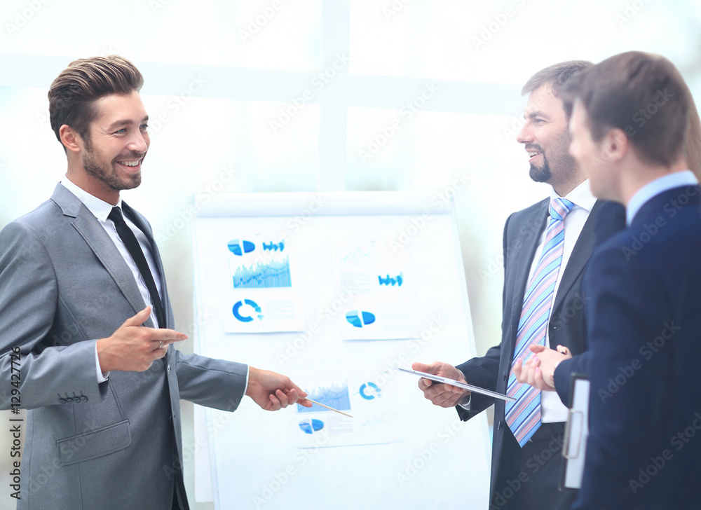 Business team discussing acquisition in meeting Business team discussing acquisition in meeting