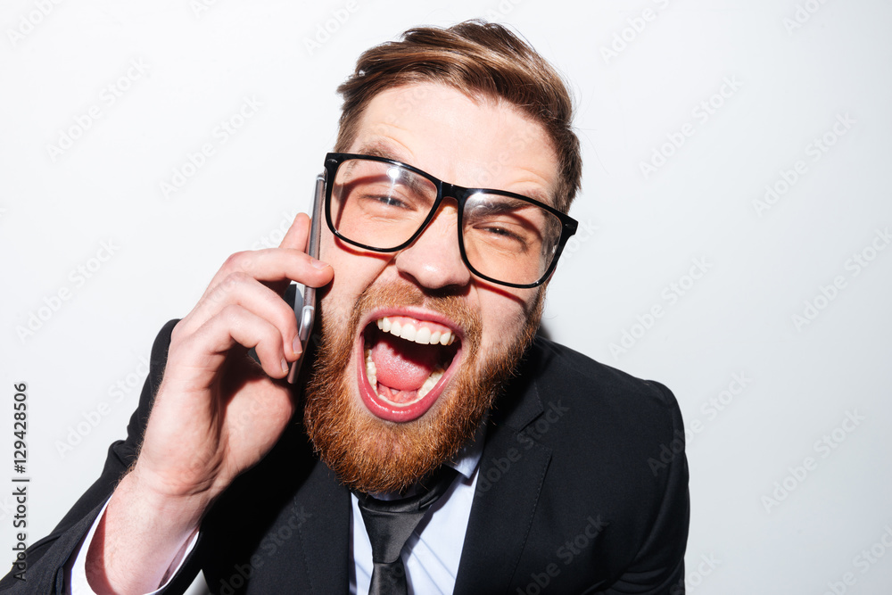 Business man screaming in phone Business man screaming in phone