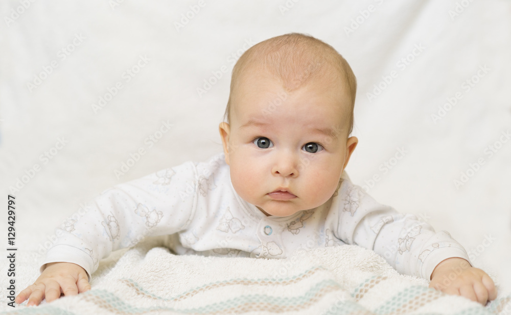 baby lying on her stomach and looking at toys baby lying on her stomach and looking at toys