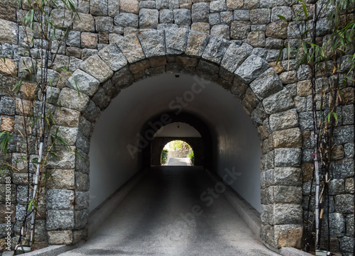 Stone tunnel with light coming from the exit.Business concept