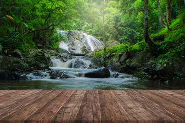 Wood floor perspective and natural mountain waterfall
