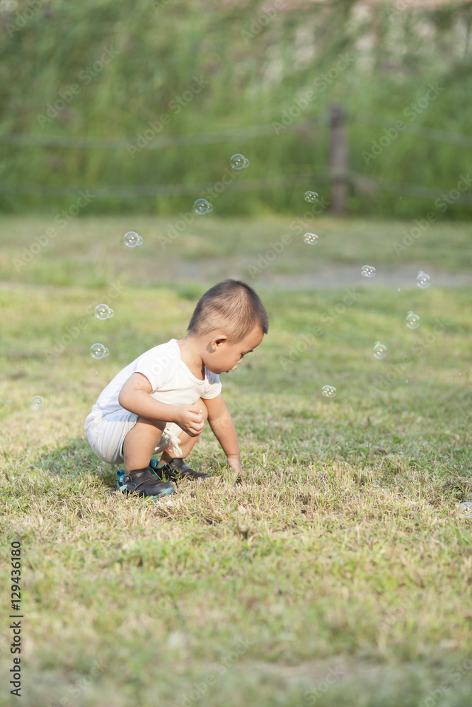 Cute Chinese baby boy playing bubbles Cute Chinese baby boy playing bubbles