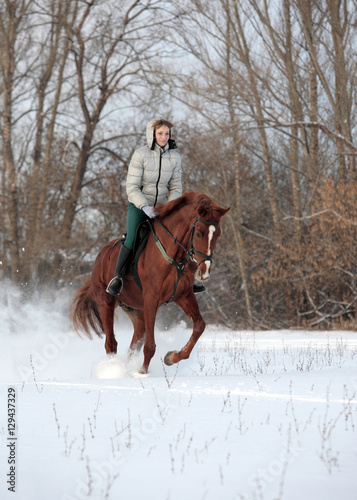 Woman riding in snow in cold winter day