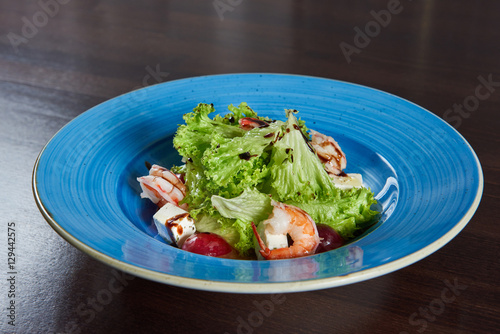Delicious shrimp salad served on a blue plate