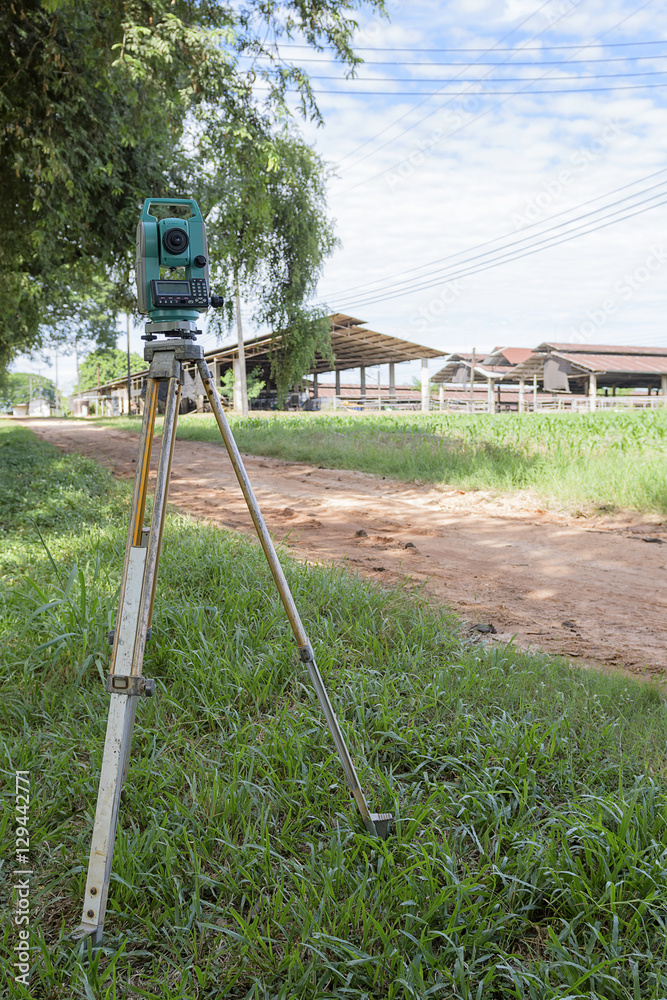 Surveyor equipment tacheometer or theodolite outdoors at constru