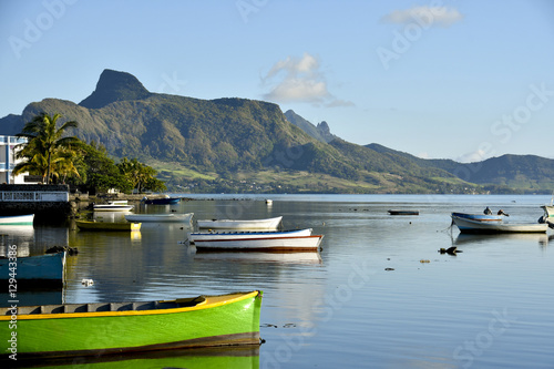 MAHEBOURG, MAURITIUS - View of the fishing landing station with green pirogue photo