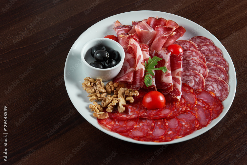 Assorted cold meat deli plate at the restaurant Assorted cold meat deli plate at the restaurant