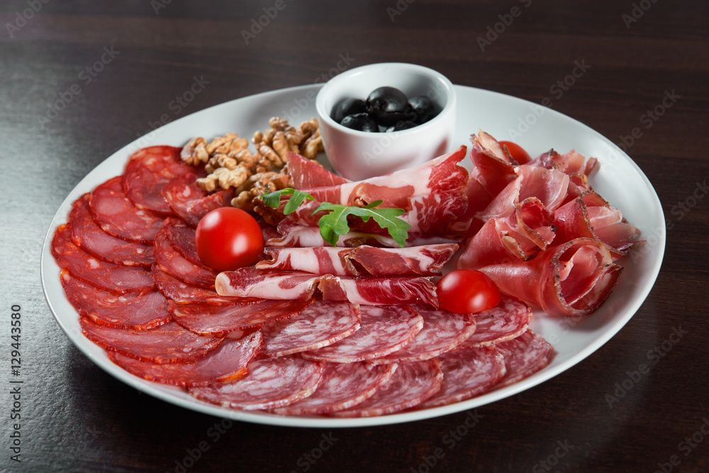 Assorted cold meat deli plate at the restaurant Assorted cold meat deli plate at the restaurant