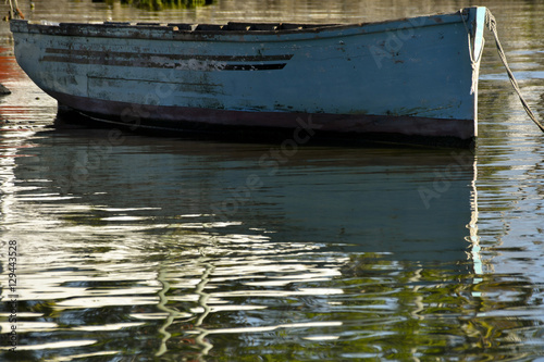 MAHEBOURG, MAURITIUS - View of a pirogue with reflections