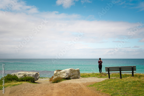 Traveler taking a photo of seascape of Cape Leeuwin, along the Indian Ocean ,Augusta Western Australia .