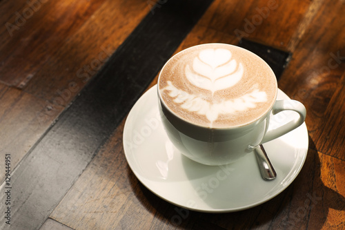 hot chocolate on rustic wood table, vintage tone