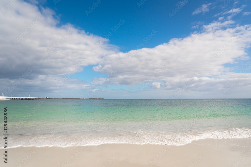 Tropical beach, with clear water in the background. Clear blue sky. Busselton, Western Australia.