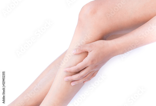 Woman hand touch her legs for Skin care and beauty concept