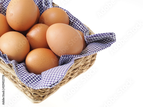 eggs in basket isolated on white background