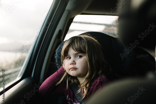 Portrait of girl in car seat