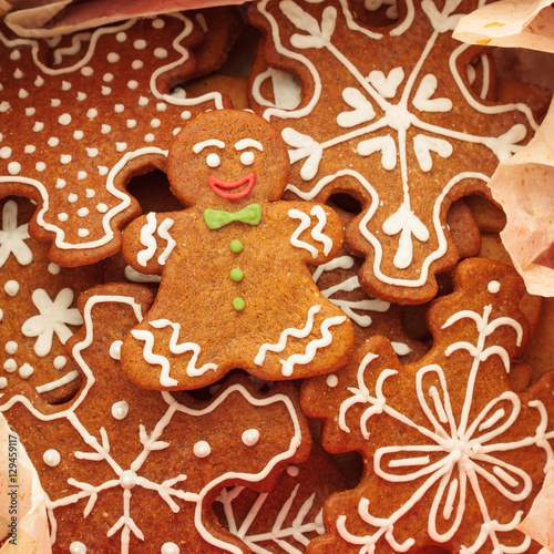 Closeup of gingerbread man cookie and snowflakes cookies 