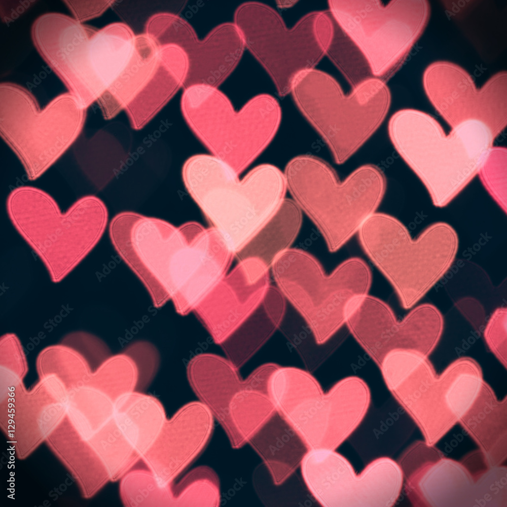 Abstract bokeh background for Valentine's Day. Abstract defocused background with colorful hearts 
