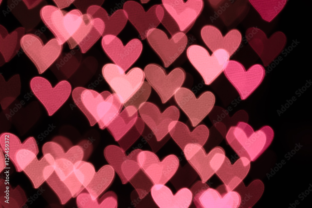 Abstract heart-shaped bokeh background. Abstract defocused background with colorful hearts Abstract heart-shaped bokeh background. Abstract defocused background with colorful hearts