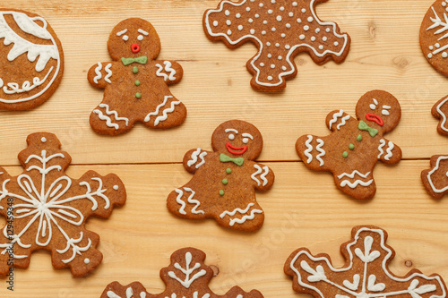 Sweet gingerbread Christmas cookies on wooden background. Sweet Christmas treat. View from above