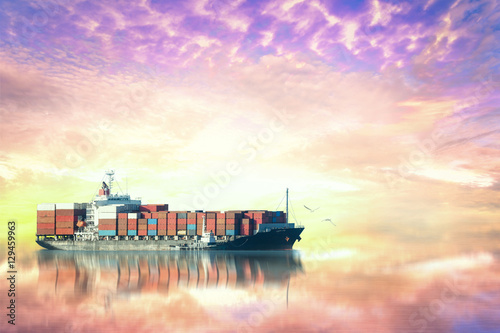 Container Cargo ship in the ocean at sunset sky, Freight Transportation, Shipping