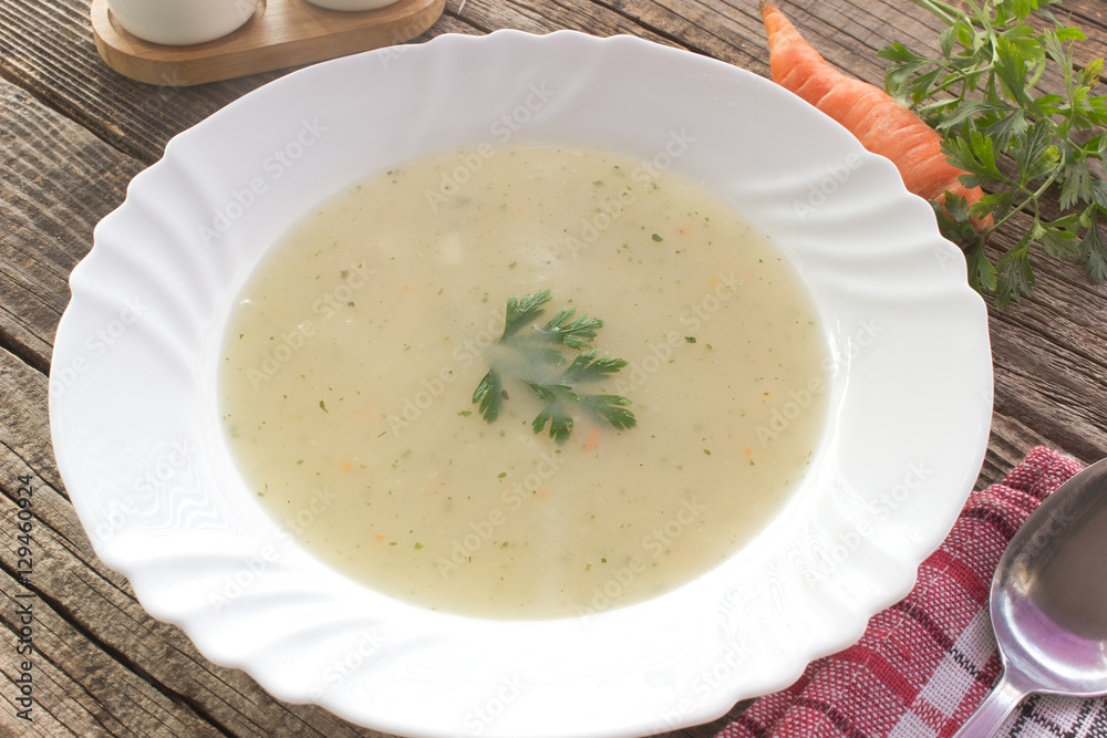 Chicken mushroom cream soup in plate on table Chicken mushroom cream soup in plate on table
