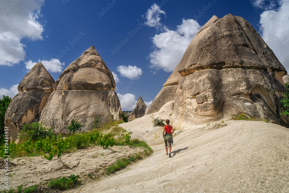 Yung girl walking in Love Valley of Cappadocia.
